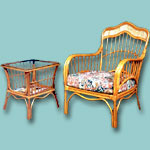 Rattan cushion single chair with small table.
